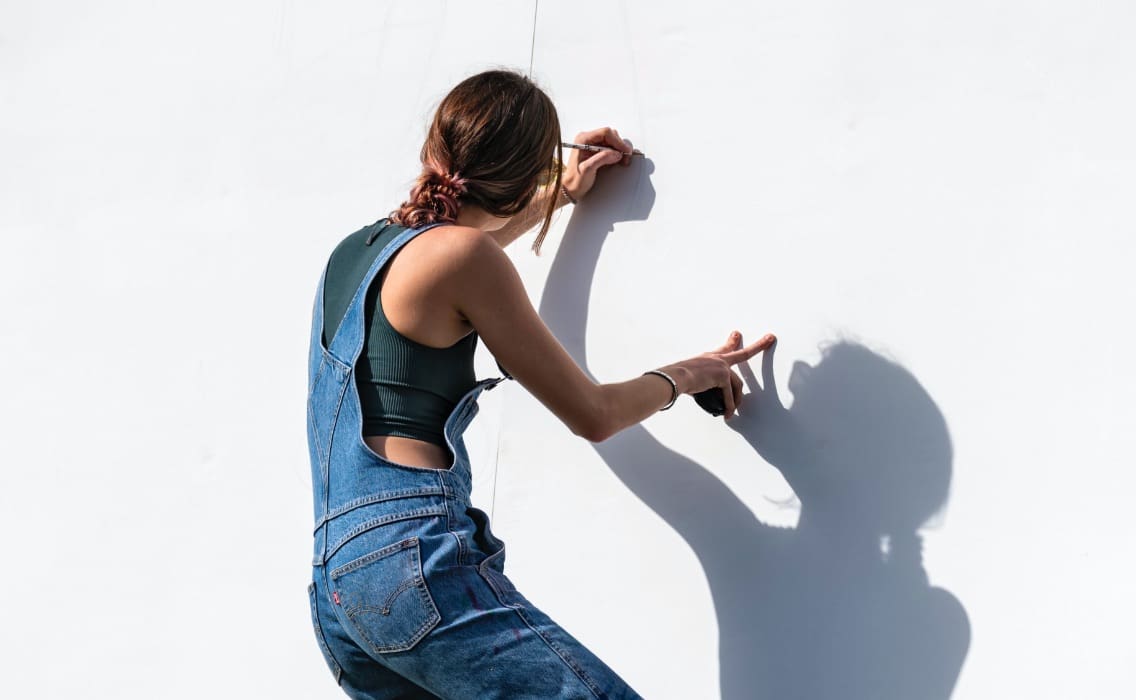 Artist painting on wall